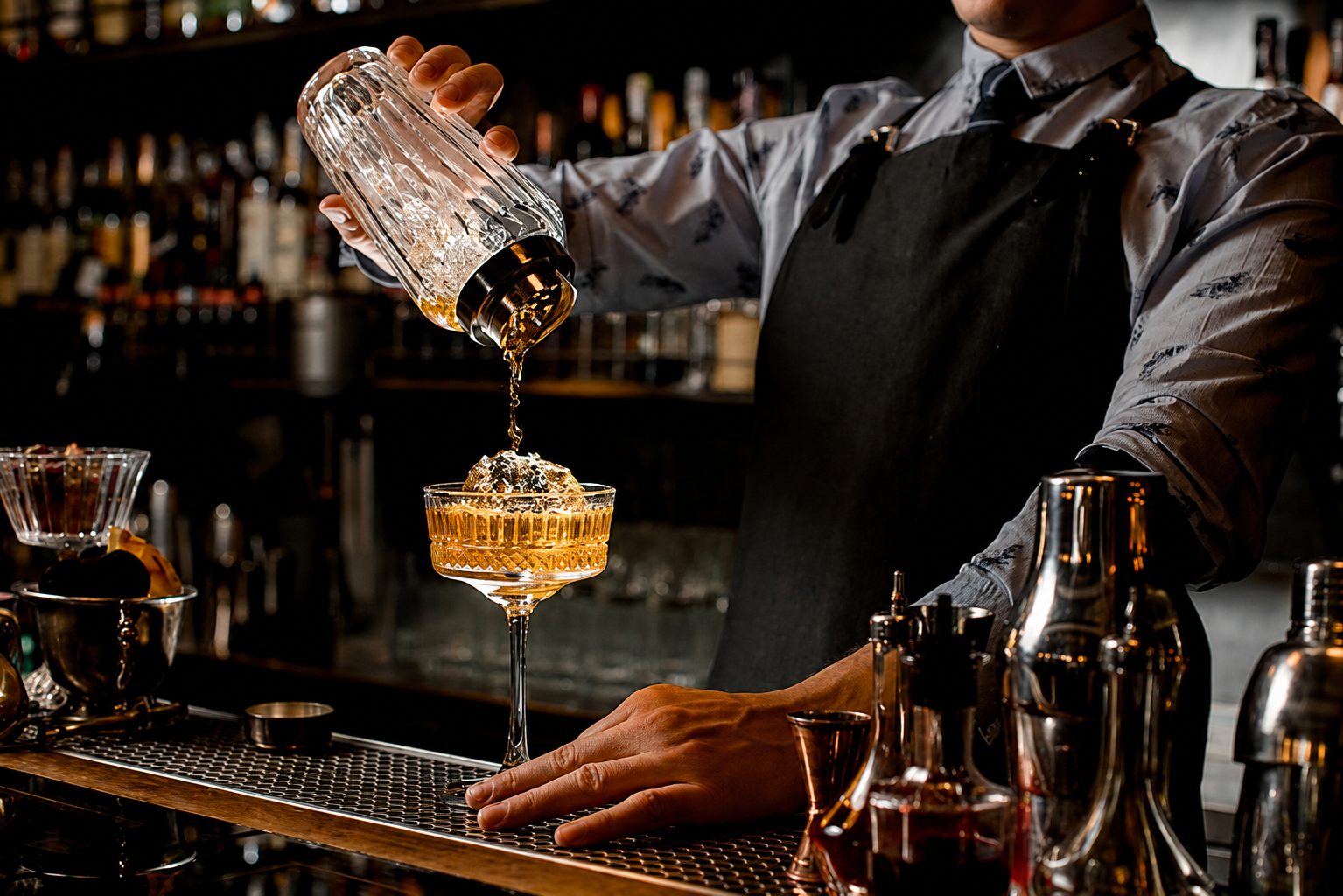 Private bartender pouring a cocktail for guests at a Central Florida celebration